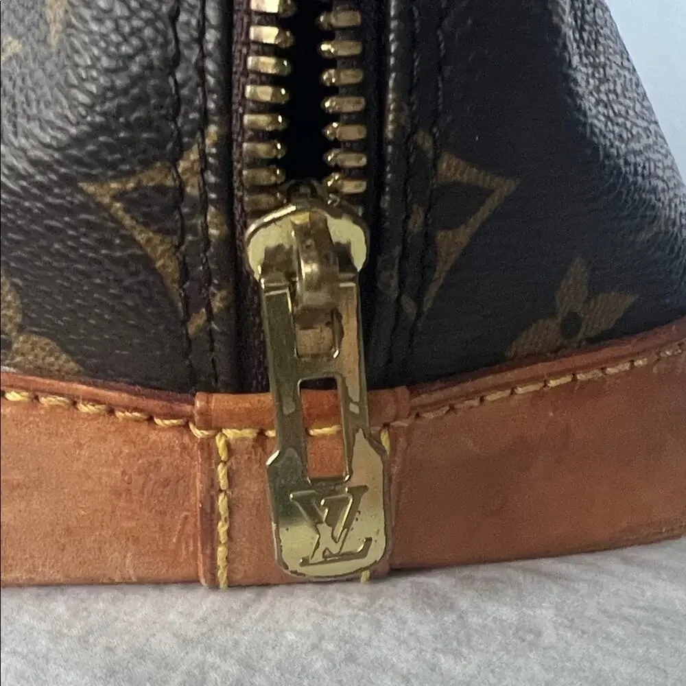 Louis Vuitton Alma PM Monogram Handbag